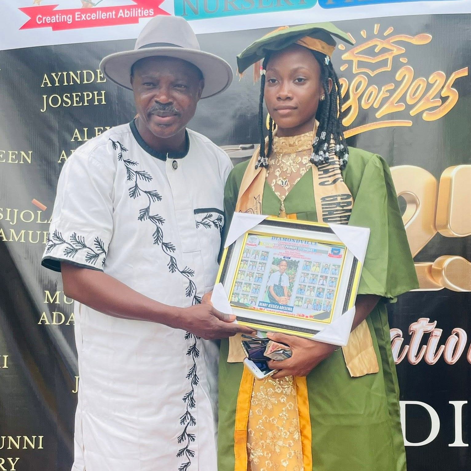 A Diamondville student with an achievement award
